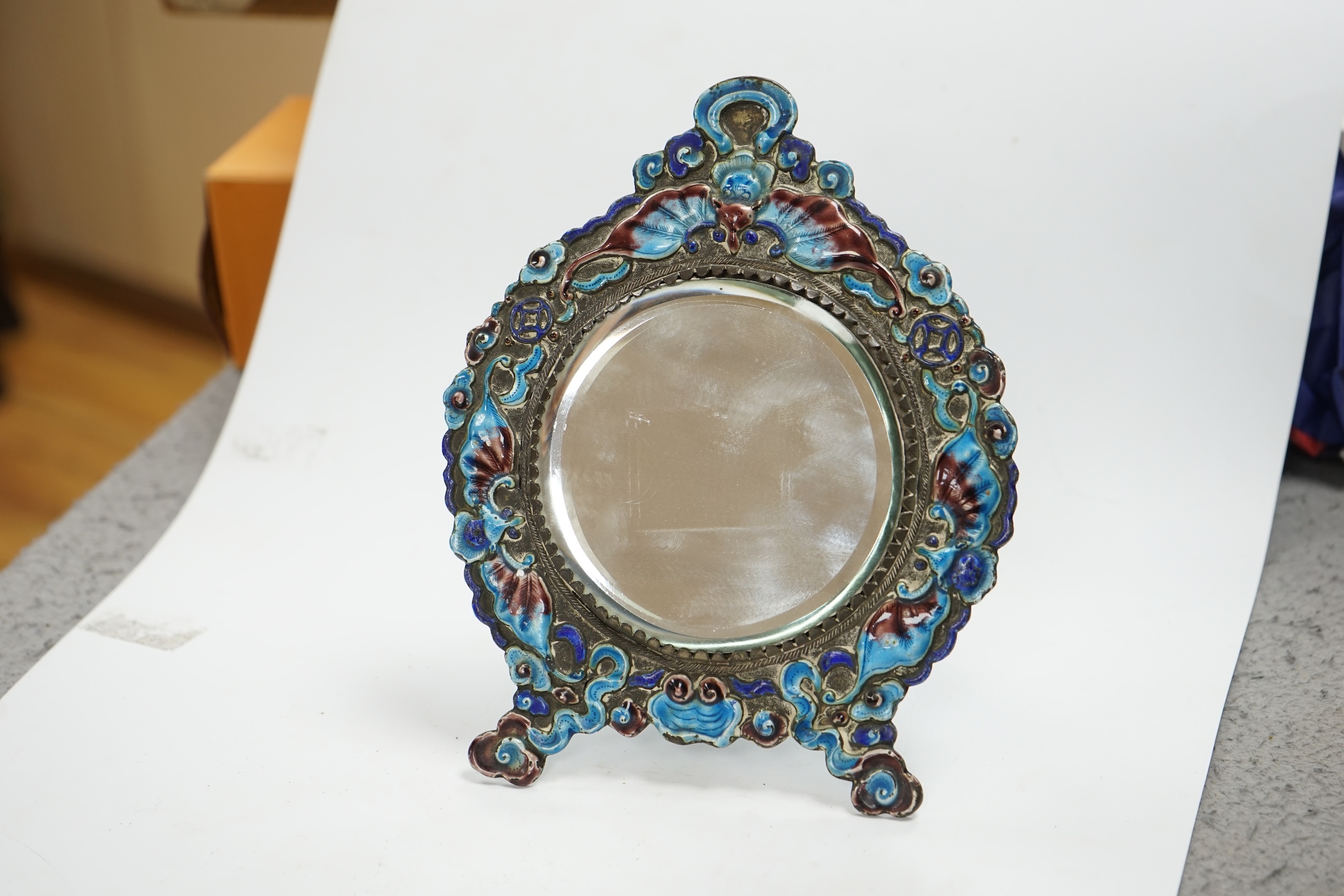 An early 20th century Chinese enamelled easel mirror, 8cm high. Condition - the metal is tarnished may need cleaning, enamel fair to good